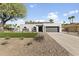 Stunning home featuring a modern design, xeriscaping, and an attached two-car garage at 5202 E Marconi Ave, Scottsdale, AZ 85254