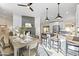 Open-concept living space featuring dining area and modern kitchen with island seating at 5202 E Marconi Ave, Scottsdale, AZ 85254