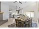 Open-concept living space featuring dining area and modern kitchen with white cabinetry at 5202 E Marconi Ave, Scottsdale, AZ 85254
