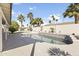 Backyard pool with a water feature, palm trees, and a privacy wall at 5202 E Marconi Ave, Scottsdale, AZ 85254