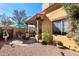 Backyard offers an outdoor patio with dining set, grill, fountain and low-maintenance desert landscaping at 5370 S Desert Dawn Dr # 39, Gold Canyon, AZ 85118