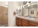 Elegant bathroom featuring double sinks, a spacious shower, and neutral tile at 5370 S Desert Dawn Dr # 39, Gold Canyon, AZ 85118
