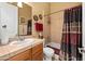 Well-lit bathroom with a shower-tub combo and tiled walls at 5370 S Desert Dawn Dr # 39, Gold Canyon, AZ 85118