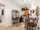 Charming dining area with a wine rack, mini fridge, and a cozy table set for two at 5370 S Desert Dawn Dr # 39, Gold Canyon, AZ 85118