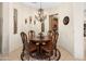 Charming dining room illuminated by a decorative chandelier, perfect for intimate gatherings and meals at 5370 S Desert Dawn Dr # 39, Gold Canyon, AZ 85118