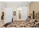 Comfortable main bedroom showing a doorway to an en suite bathroom at 5370 S Desert Dawn Dr # 39, Gold Canyon, AZ 85118