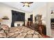 Bright main bedroom featuring hardwood floors, a ceiling fan, and natural light at 5370 S Desert Dawn Dr # 39, Gold Canyon, AZ 85118