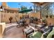 Outdoor patio featuring a dining table, umbrella, grill, and comfortable seating area at 5370 S Desert Dawn Dr # 39, Gold Canyon, AZ 85118