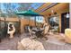 Outdoor patio featuring a dining table, umbrella, grill, and decorative fountain at 5370 S Desert Dawn Dr # 39, Gold Canyon, AZ 85118