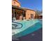 Community pool and hot tub with lounge seating for relaxing on sunny days at 5370 S Desert Dawn Dr # 39, Gold Canyon, AZ 85118