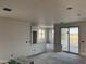 Partially finished living room with drywall installed, showing the potential of a bright and airy space at 5981 N Nigal Rd, Casa Grande, AZ 85194