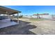 Large backyard with a covered patio and block fence, ready for entertaining and creating your outdoor oasis at 7044 W Sierra St, Peoria, AZ 85345