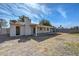 Expansive backyard with covered patio, offering a blank canvas for landscaping and outdoor living ideas at 7044 W Sierra St, Peoria, AZ 85345