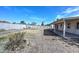 Spacious backyard featuring a covered patio and block fence, an ideal space for outdoor activities and relaxation at 7044 W Sierra St, Peoria, AZ 85345