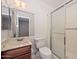 Standard bathroom with a marble countertop, a toilet, and a shower with sliding doors at 7044 W Sierra St, Peoria, AZ 85345