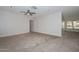 Spacious bedroom with neutral carpet, a ceiling fan, and large closet at 7044 W Sierra St, Peoria, AZ 85345