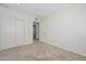 Bedroom with double-door closet and doorway leading to another room at 7044 W Sierra St, Peoria, AZ 85345