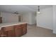 View of kitchen with breakfast bar, offering an inviting space for cooking and dining at 7044 W Sierra St, Peoria, AZ 85345