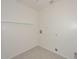 Laundry room with tiled floors, white walls and washer and dryer hookups at 7044 W Sierra St, Peoria, AZ 85345