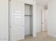 Bedroom features a neutral carpet and sliding closet doors at 7449 W Buckhorn Trl, Peoria, AZ 85383