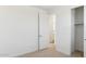 Freshly painted bedroom with an open door to the on-suite bathroom, and a closet at 7449 W Buckhorn Trl, Peoria, AZ 85383