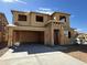 New home under construction showcasing the framing stage with a two car garage at 7449 W Buckhorn Trl, Peoria, AZ 85383