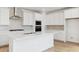 Bright, white kitchen featuring stainless steel appliances, quartz countertops, and decorative tile backsplash at 7449 W Buckhorn Trl, Peoria, AZ 85383