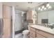 Updated bathroom with a glass-enclosed shower, neutral cabinets, and a bright vanity area at 7950 E Camelback Rd # 211, Scottsdale, AZ 85251