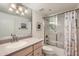 Bathroom featuring vanity with drawers and framed mirror, with a shower and tub combination at 7950 E Camelback Rd # 211, Scottsdale, AZ 85251