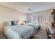 Twin beds, plush carpets, and ample natural light make this bedroom inviting and comfortable at 7950 E Camelback Rd # 211, Scottsdale, AZ 85251
