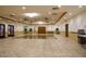 Large, tiled clubhouse with ceiling fans, a water cooler, and wall decor at 7950 E Camelback Rd # 211, Scottsdale, AZ 85251