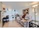 Cozy office area with built-in shelves, a comfortable recliner, and warm lighting at 7950 E Camelback Rd # 211, Scottsdale, AZ 85251