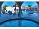Pool area with a hot tub and lounge chairs, offering relaxation and recreation at 7950 E Camelback Rd # 211, Scottsdale, AZ 85251
