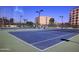 Well-maintained tennis courts surrounded by landscaping and apartment buildings at 7950 E Camelback Rd # 211, Scottsdale, AZ 85251