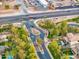 Community entrance aerial view showcases lush landscaping and well maintained streets providing a welcoming neighborhood at 835 E Virgo Pl, Chandler, AZ 85249