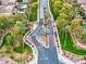 Community entrance aerial view showcases lush landscaping and well maintained streets providing a welcoming neighborhood at 835 E Virgo Pl, Chandler, AZ 85249