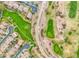 Aerial view showing residential homes, a greenbelt, and a nearby golf course at 835 E Virgo Pl, Chandler, AZ 85249