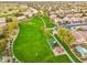 Community aerial view highlighting a green space, playground, picnic area, and walking paths within a neighborhood at 835 E Virgo Pl, Chandler, AZ 85249