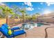 Resort-style backyard pool area with lounge chairs, desert landscaping, and a patio at 835 E Virgo Pl, Chandler, AZ 85249