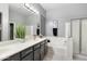 Bright primary bathroom featuring a double vanity, walk-in shower, and soaking tub, perfect for relaxation at 835 E Virgo Pl, Chandler, AZ 85249