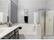 Primary bathroom showcasing a luxurious soaking tub, a separate shower, and elegant decorative accents at 835 E Virgo Pl, Chandler, AZ 85249