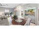 Open-concept dining area with views of the backyard pool, seamlessly connected to the living room at 835 E Virgo Pl, Chandler, AZ 85249