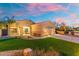 Single-story home with a well-maintained lawn, mature landscaping, and a two-car garage at 835 E Virgo Pl, Chandler, AZ 85249