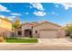 Charming single-story home featuring a two-car garage, low maintenance front yard, and tasteful stone accents at 835 E Virgo Pl, Chandler, AZ 85249