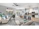 Spacious living area connects to kitchen, featuring modern decor and backyard views at 835 E Virgo Pl, Chandler, AZ 85249