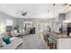 Open floor plan showcasing living room with backyard views and adjacent kitchen with breakfast bar at 835 E Virgo Pl, Chandler, AZ 85249