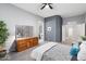 Spacious main bedroom with gray walls, a wooden dresser, and ensuite bathroom at 835 E Virgo Pl, Chandler, AZ 85249