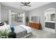 Spacious main bedroom with a large window overlooking the pool, complemented by stylish furnishings at 835 E Virgo Pl, Chandler, AZ 85249