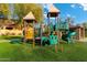 Close up of a neighborhood playground with a slide, swings, and artificial turf at 835 E Virgo Pl, Chandler, AZ 85249