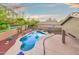 Backyard pool with mature landscaping and an extended patio creating a relaxing outdoor living space at 835 E Virgo Pl, Chandler, AZ 85249